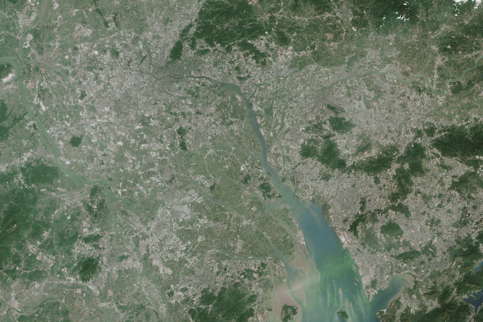 Landsat satellite image of the Pearl River Delta in November 2014, showing nearly continuous built-up land around the estuary